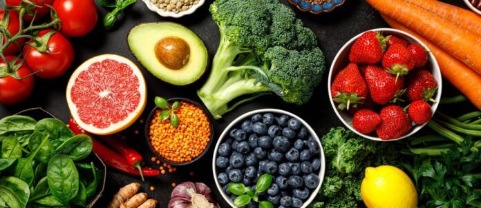 Table full of fruits, vegetables, and berries